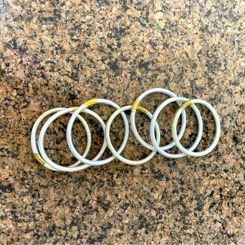 8 Silver Buddha Girl bangles, never worn!
